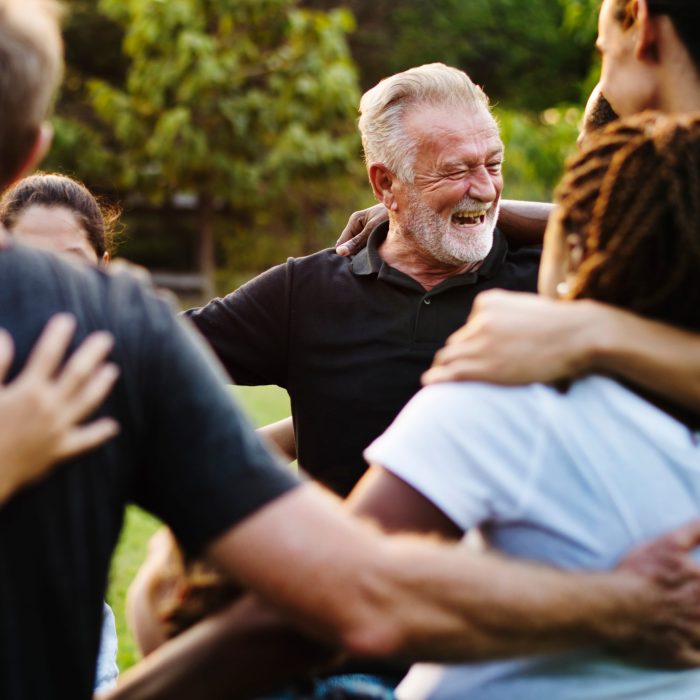 Happiness group of people huddle and smiling together